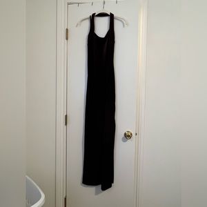 Dark purple velvet floor length dress. Thigh high slit.